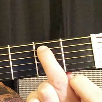 Example of How to Play an Open E Minor Dominant 7 Chord on the Guitar